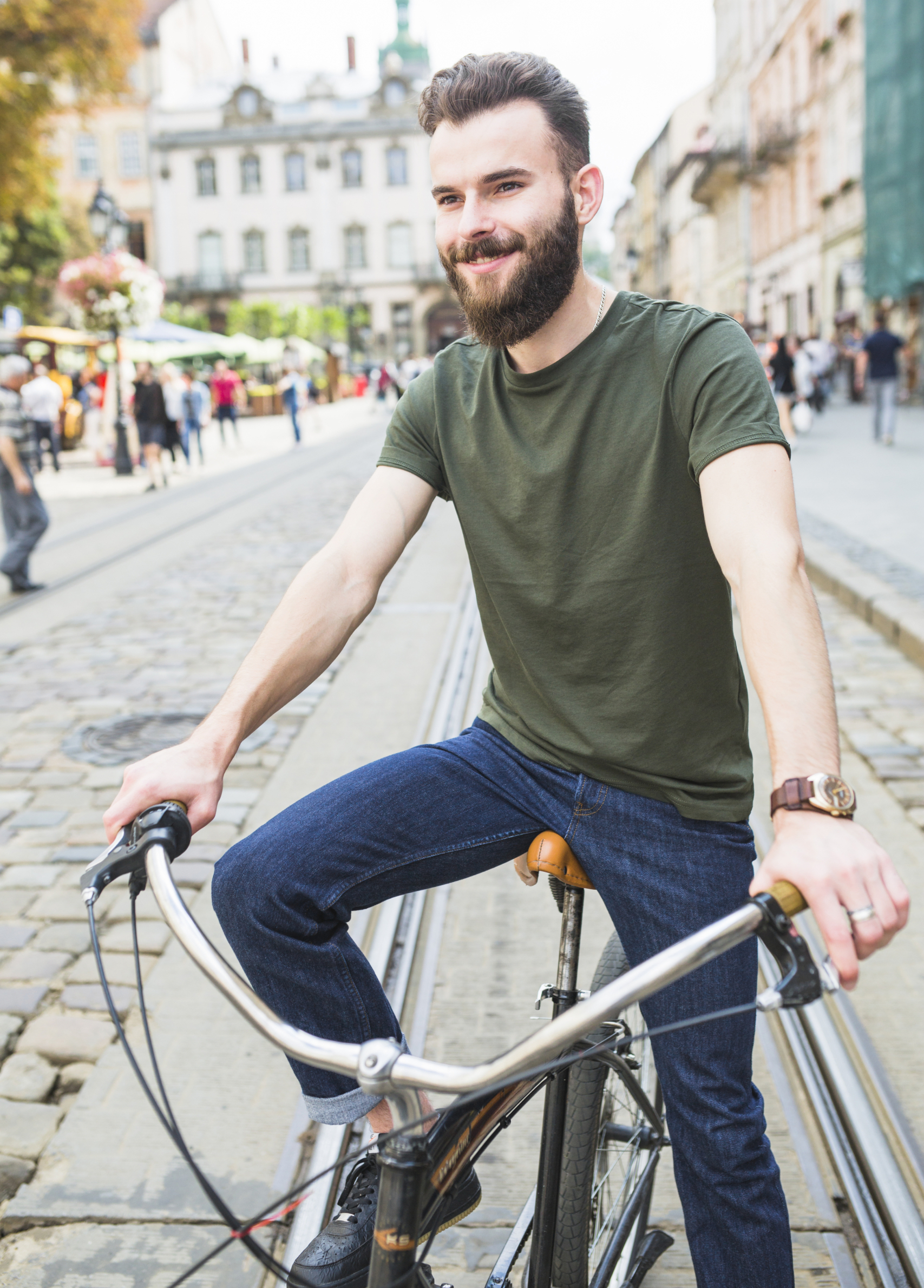 portrait-happy-young-man-with-bicycle
